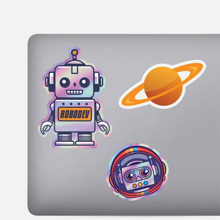 A laptop with three custom shaped stickers printed by StickerGiant applied to it