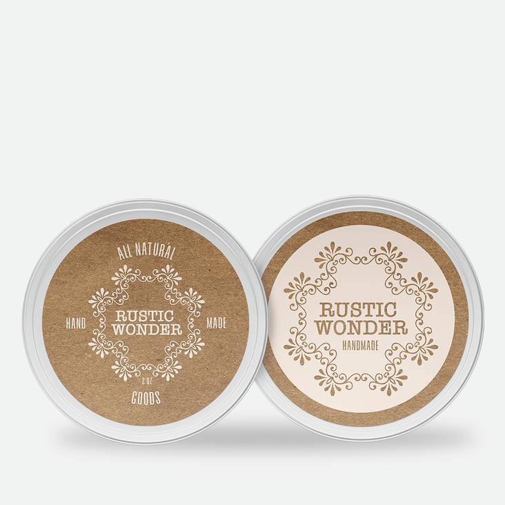 Two metal tins with kraft paper labels printed by StickerGiant applied to the top of the tins