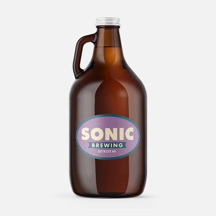 A brown glass growler with an oval sticker printed by StickerGiant applied to the side