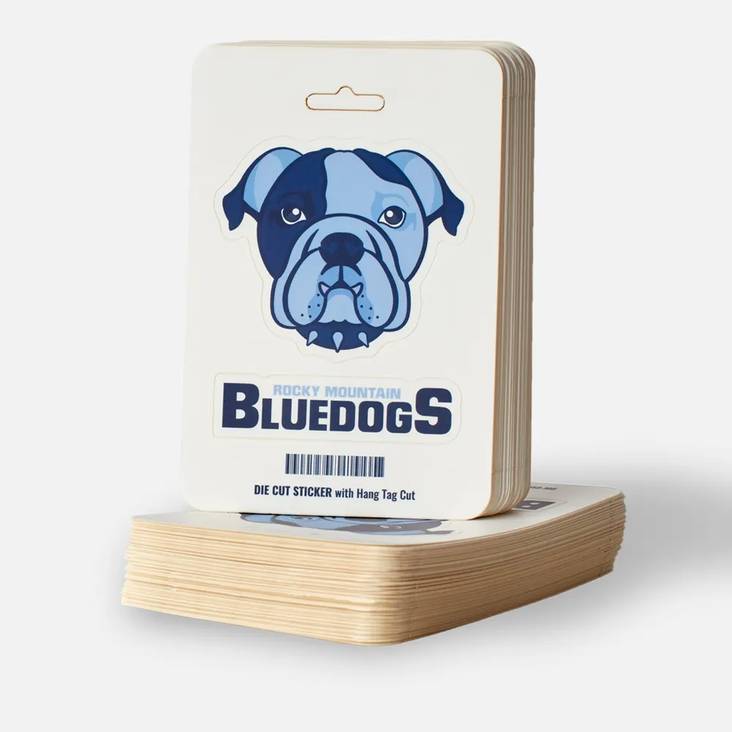 Two stacks of Rocky Mountain Bluedogs hang tag sticker sheets printed by StickerGiant with two peel off stickers on the sheet